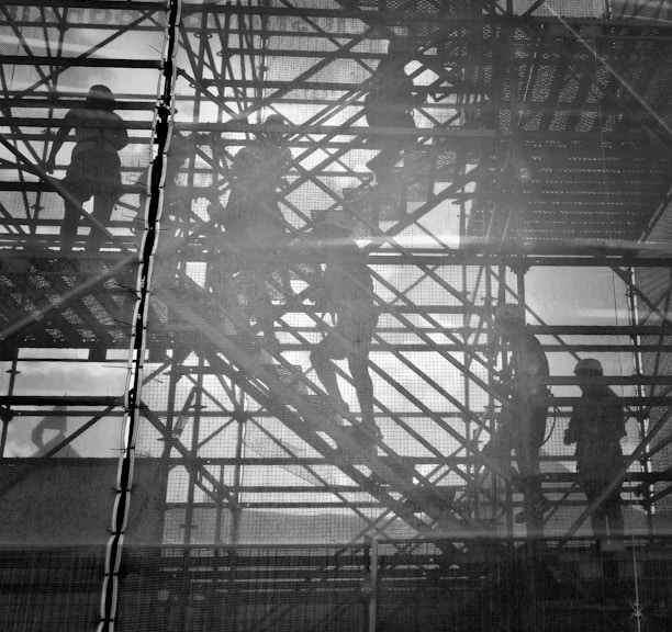 black and white photo of people going upstairs