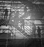 black and white photo of people going upstairs