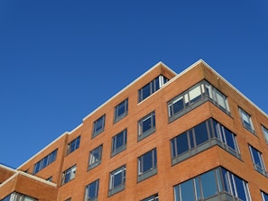 Exterior shot of the 125 Cherry Street building under a clear blue sky.