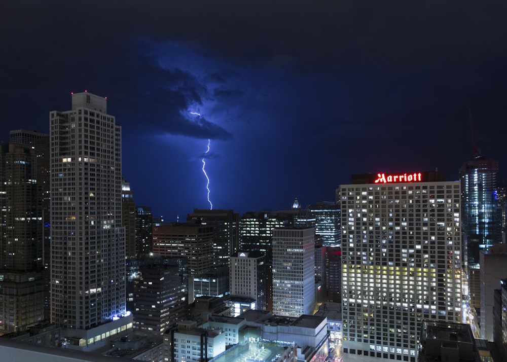 lightning bolt near skyscrapers