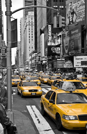 A city youth cab navigating smoothly through a busy urban street in New Mexico.
