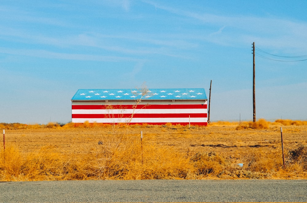 red and blue barn during daytime