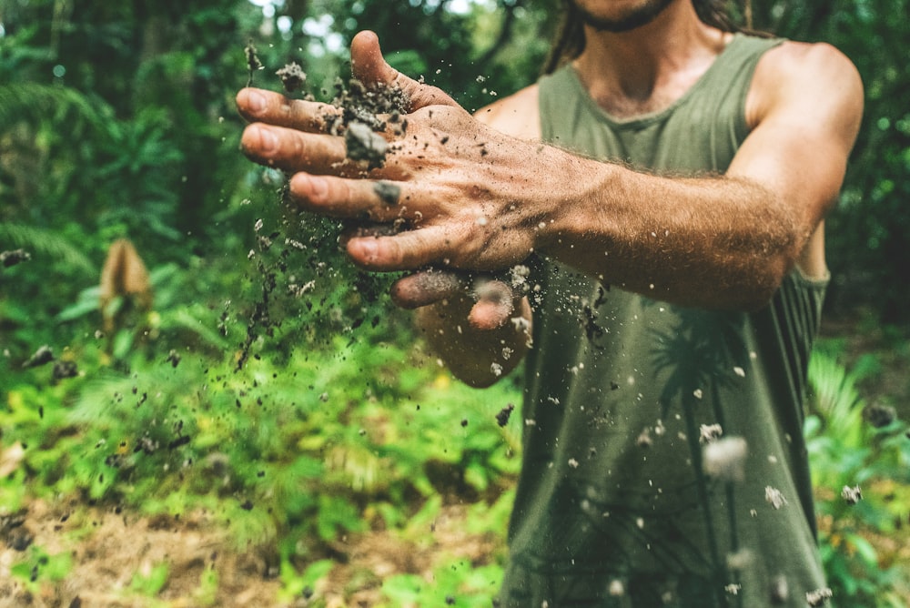 man playing with sand