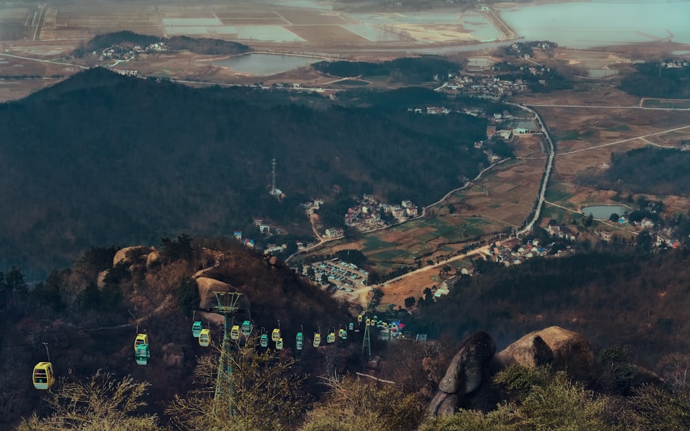 cable cars on mountain during daytime