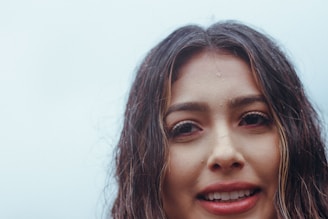 Close-up of a woman with shiny, healthy hair after a workout session