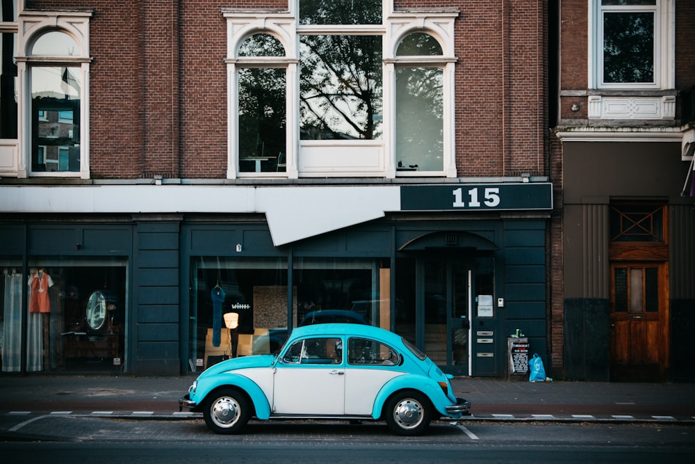 Volkswagen Beetle parking near building beside road