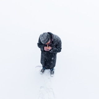 man standing on snow