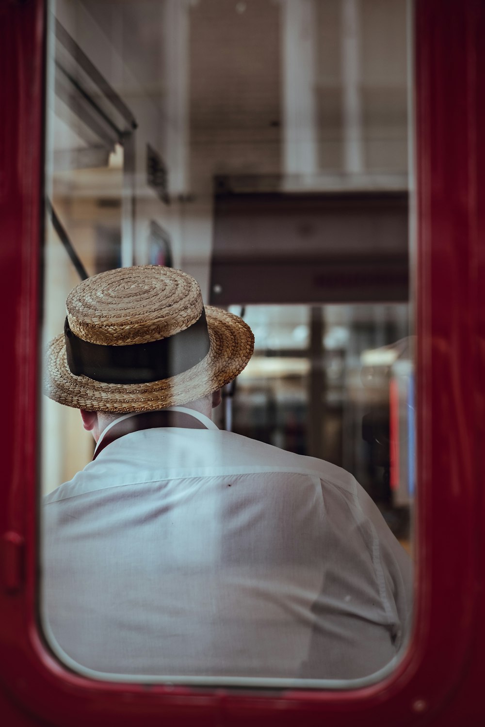 man sitting on chair inside train during day time