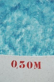Close-up of a technician testing pool water chemistry.