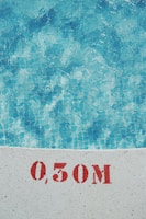 A technician monitoring water quality in a swimming pool.