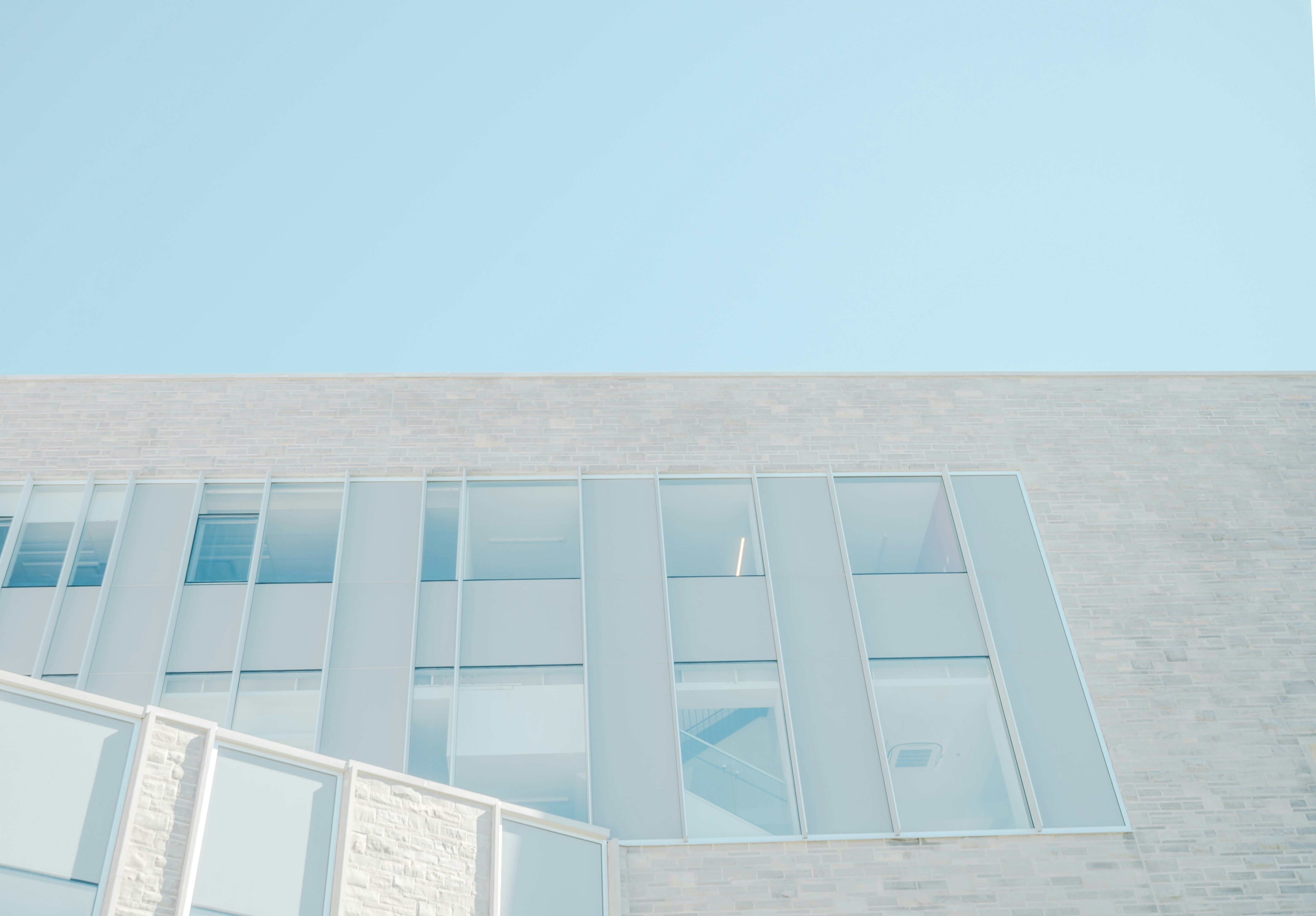 Stairwell behind tall windows