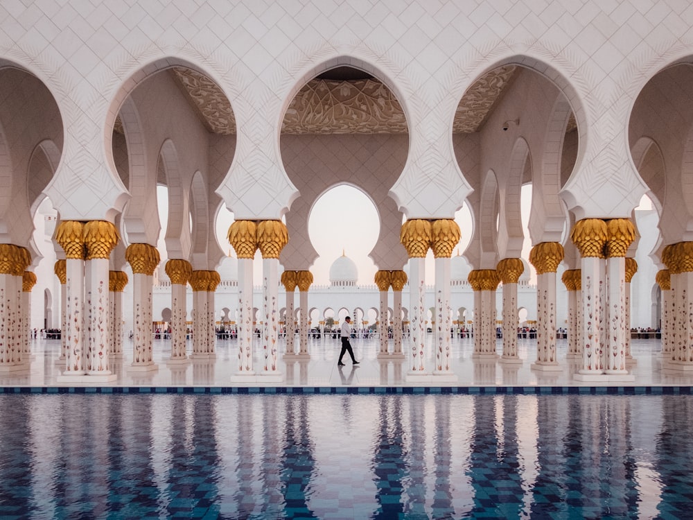 man walking on near swimming pool