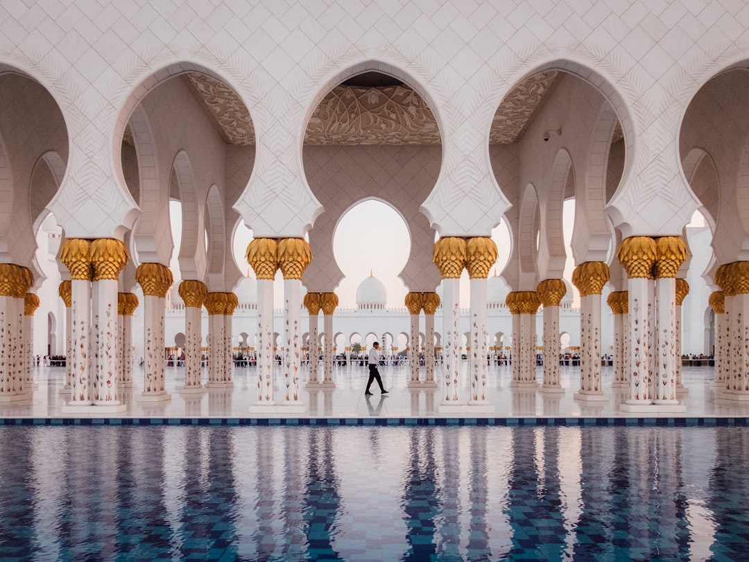 man walking on near swimming pool, Walking Through A Mosque