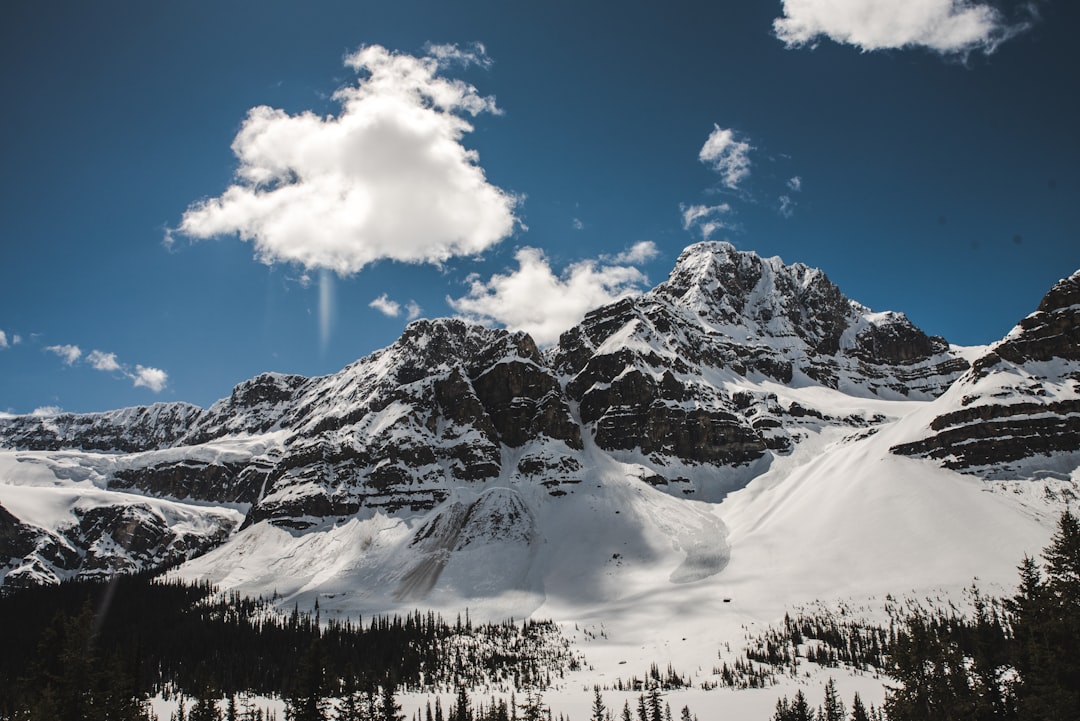 snow capped mountain under cloudy sky