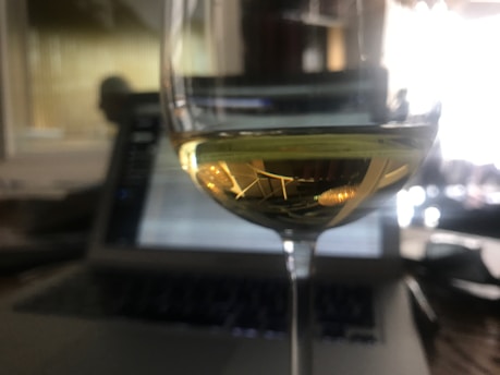 Close-up of a laptop screen showing engaging content about La Châtelaine wines.