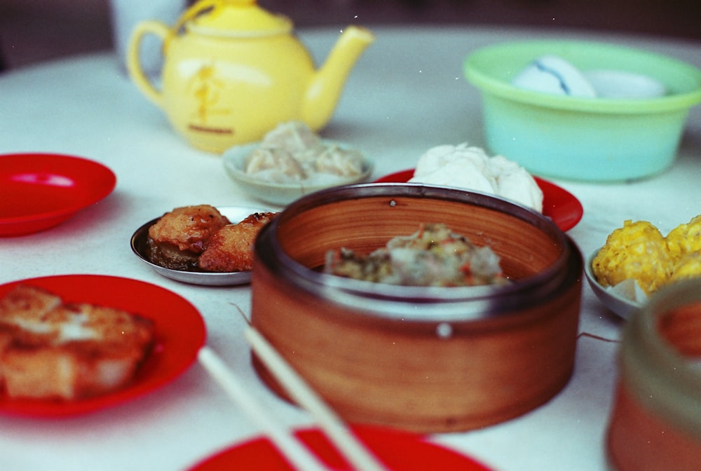 cooked foods on brown bowls and saucers