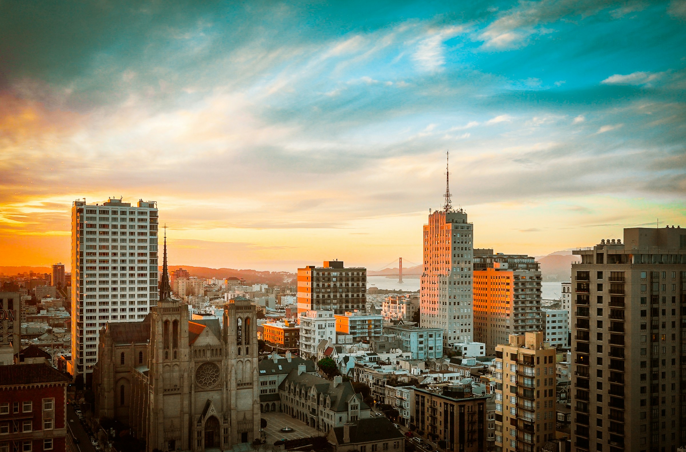 brown church surrounded with buildings, 