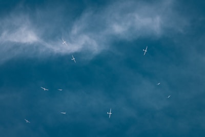 Close-up of a glider soaring gracefully against a clear blue sky.