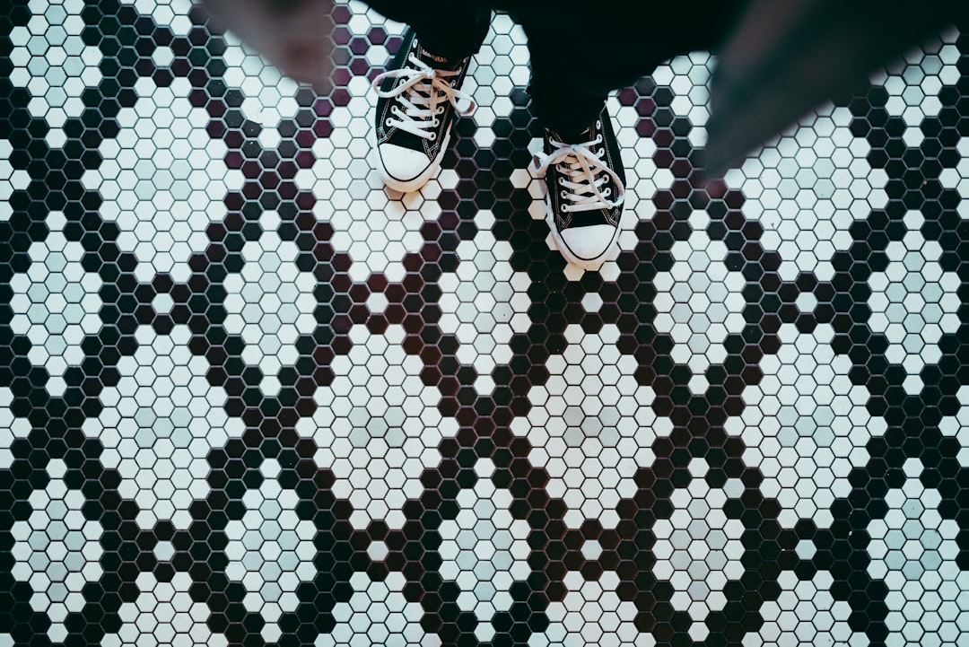 person standing wearing black sneakers,