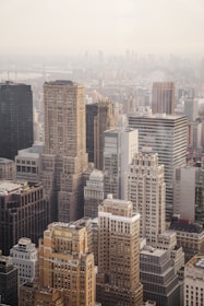 aerial view of city under cloudy sky during day time
