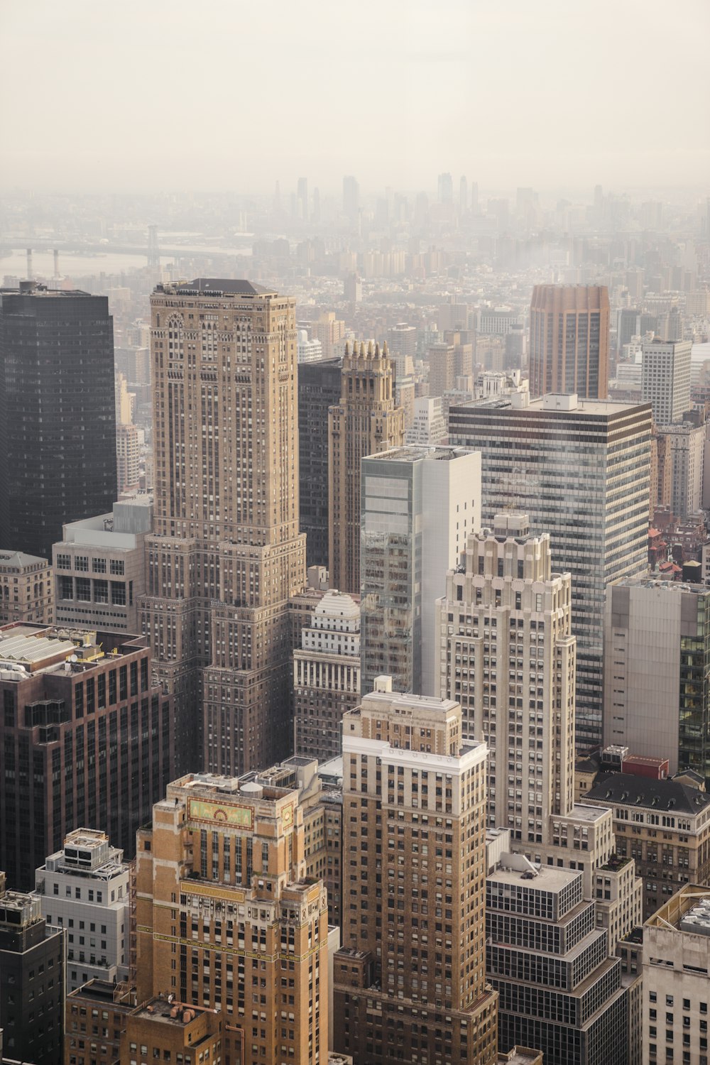 aerial view of city under cloudy sky during day time