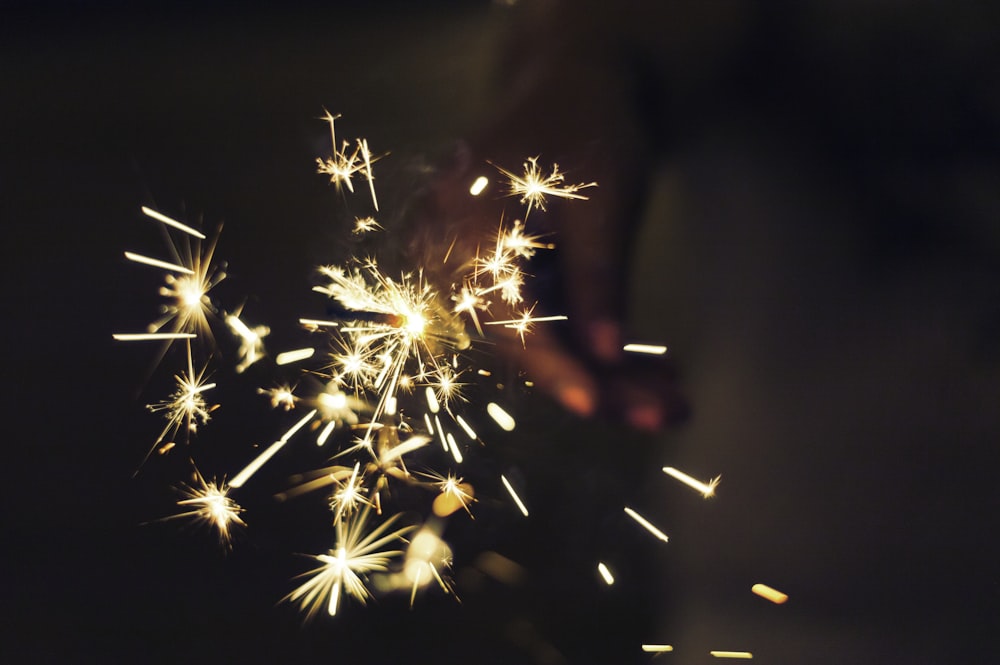 person holding sparkler