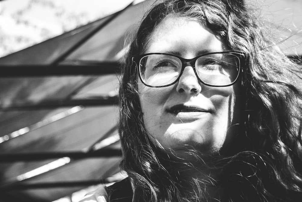 grayscale photo of woman wearing eyeglasses