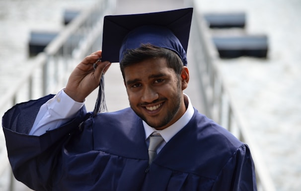 man holding his graduation cap