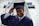 man holding his graduation cap