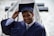 man holding his graduation cap