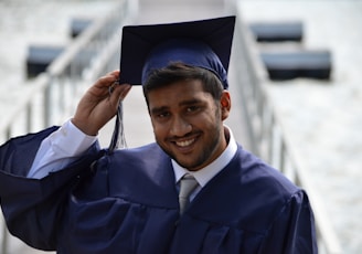 man holding his graduation cap