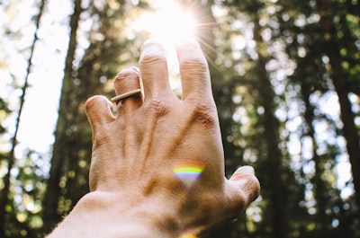 person's hang reaching out sunlight spiritual zoom background