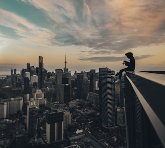 person sitting on top of the building