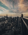 person sitting on top of the building