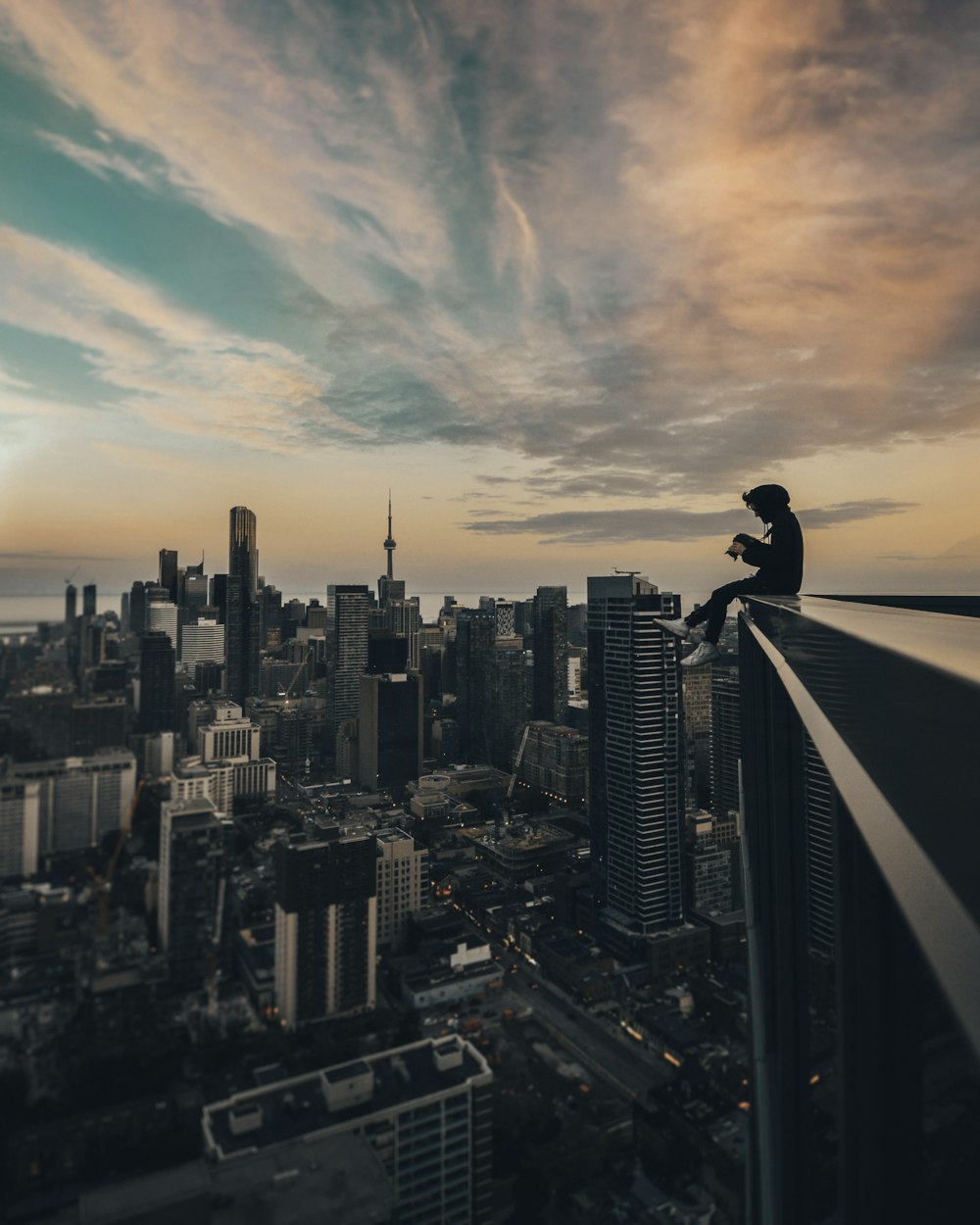 person sitting on top of the building