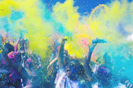 people holding pouches with colored powders