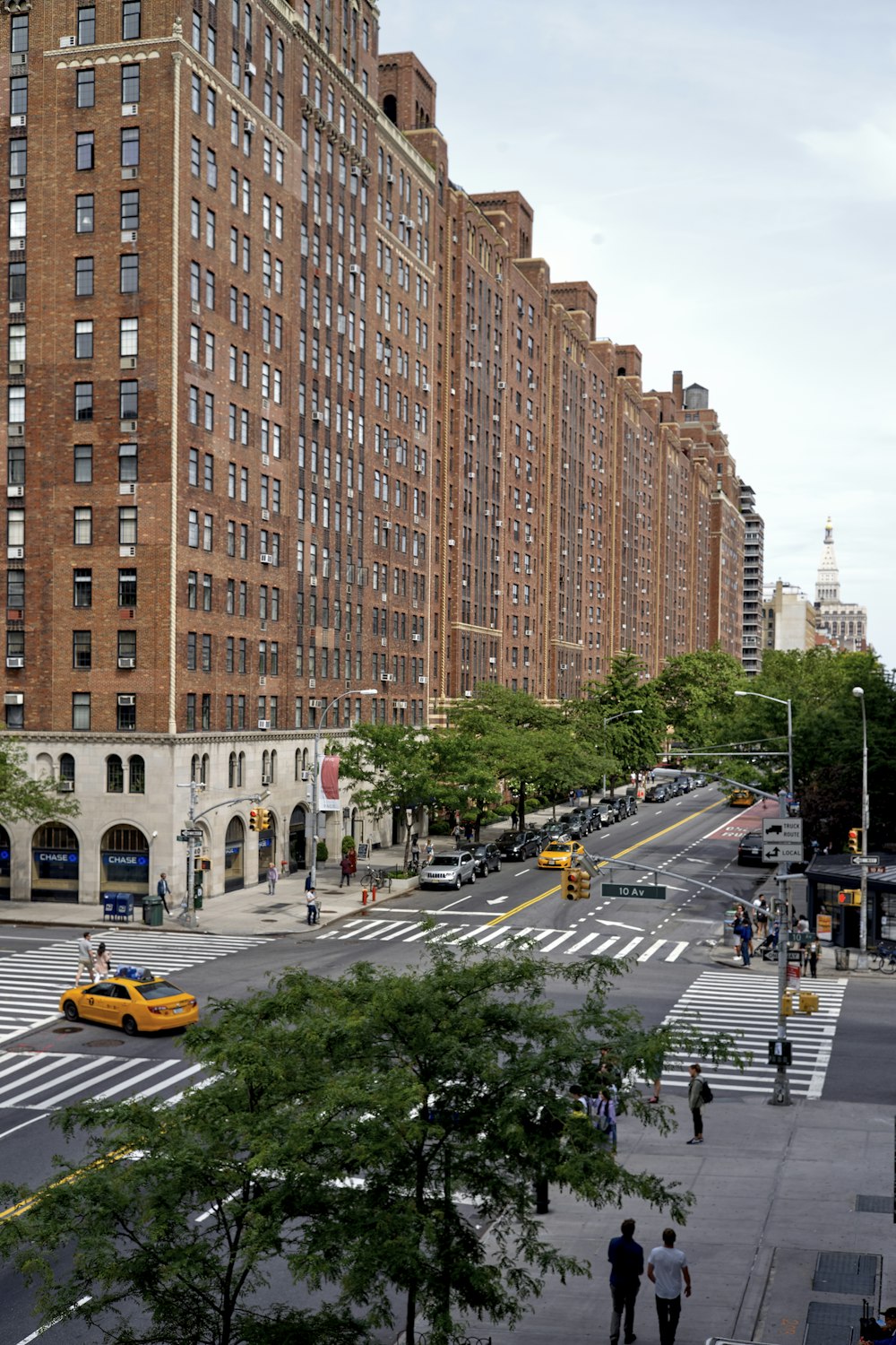 vehicles on road between buildings