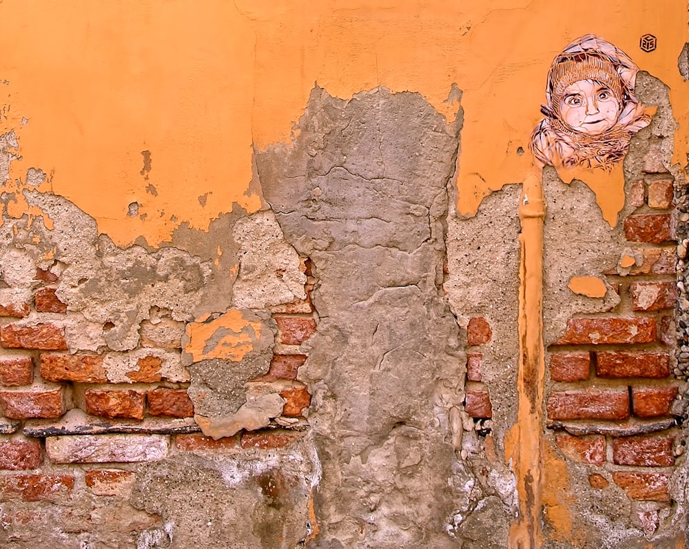 closeup photo of orange and gray wall paint