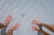 man and woman on seashore nearby starfish