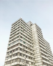 low-angle photography of grey high-rise building