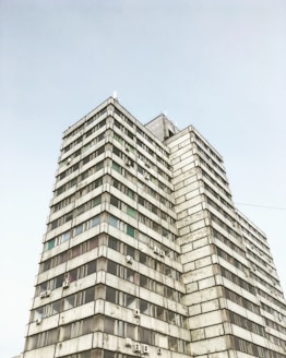 low-angle photography of grey high-rise building