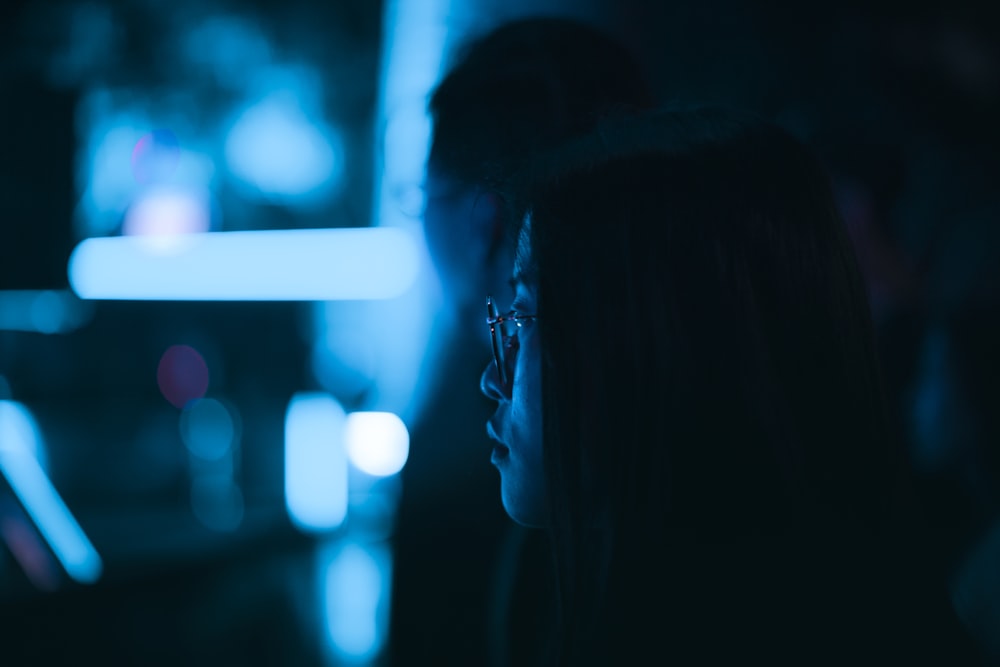 selective focus photography of woman wearing eyeglasses