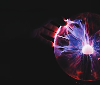 human hand holding plasma ball