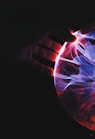 human hand holding plasma ball