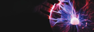 human hand holding plasma ball