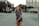 woman walking in the middle of the road