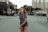 woman walking in the middle of the road