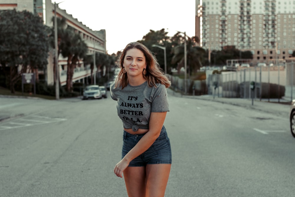 woman walking in the middle of the road