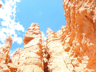 Close-up of colorful rock formations under a bright blue sky in Death Valley.