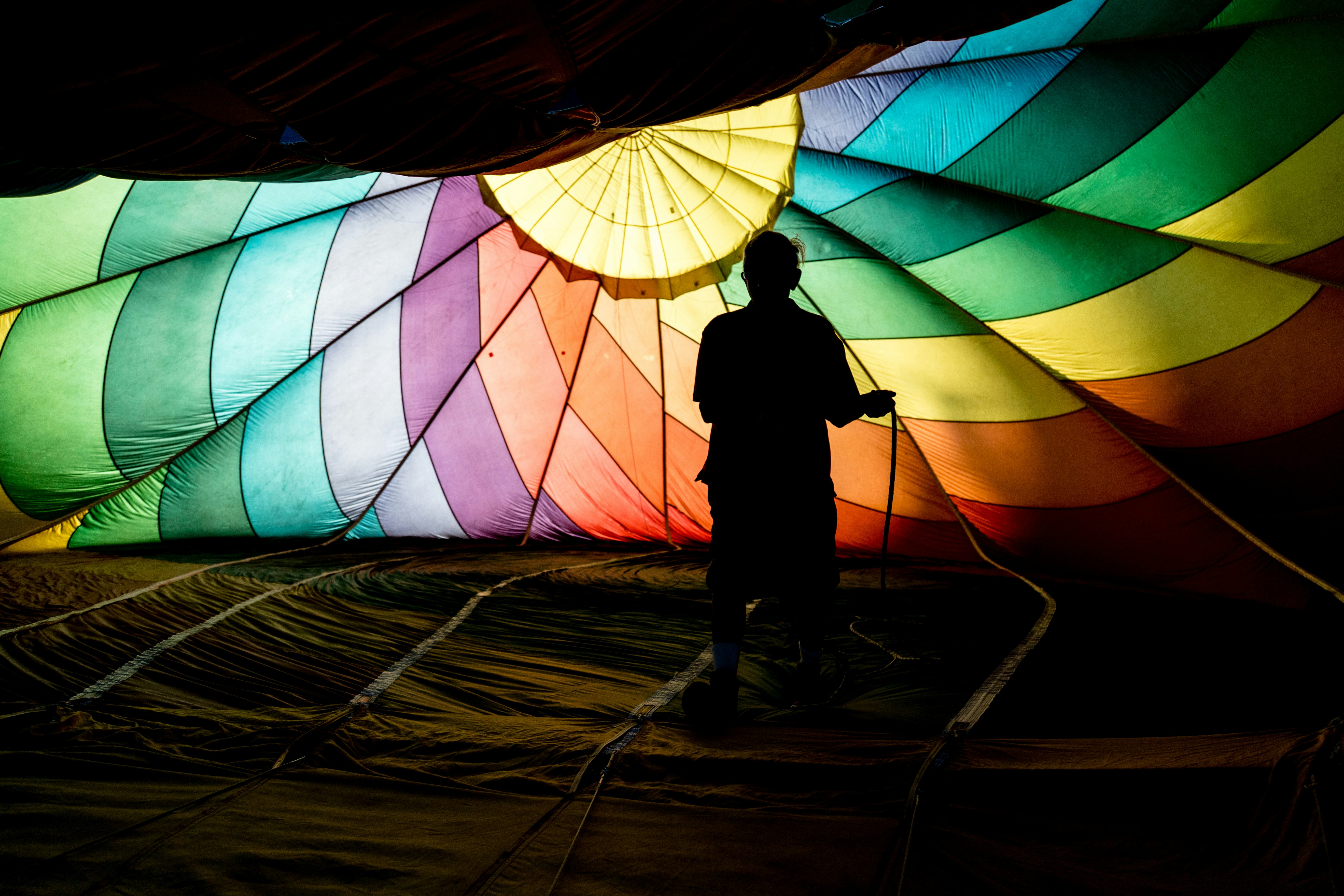 person holding parachute